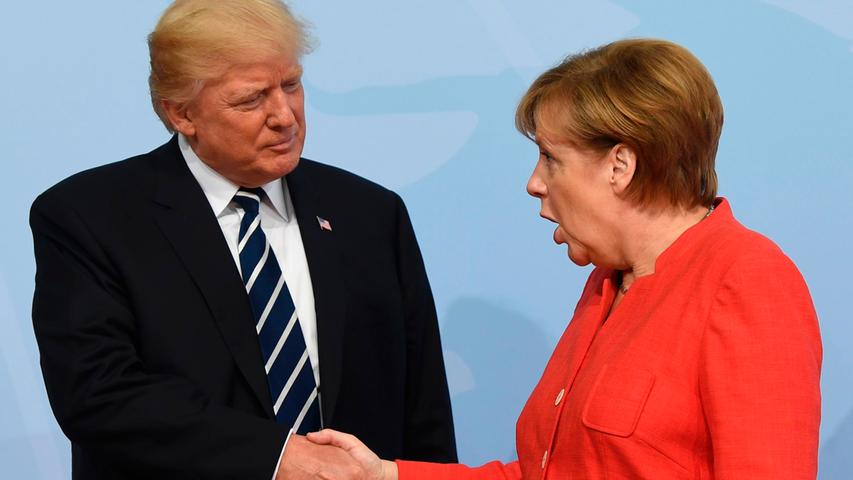 Völlig baff: Angela Merkel beim Händedruck mit US-Präsident Donald Trump. Die Gründe für das Erstaunen sind unbekannt.