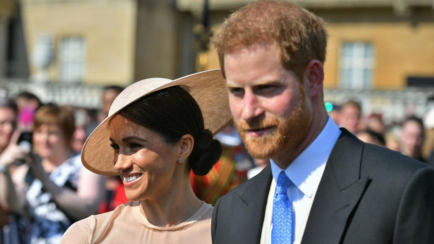 Prinz Harry und Herzogin Meghan kommen zu einem Gartenfest im Buckingham Palace. Es ist der erste öffentliche Auftritt nach ihrer Hochzeit am 19. Mai.