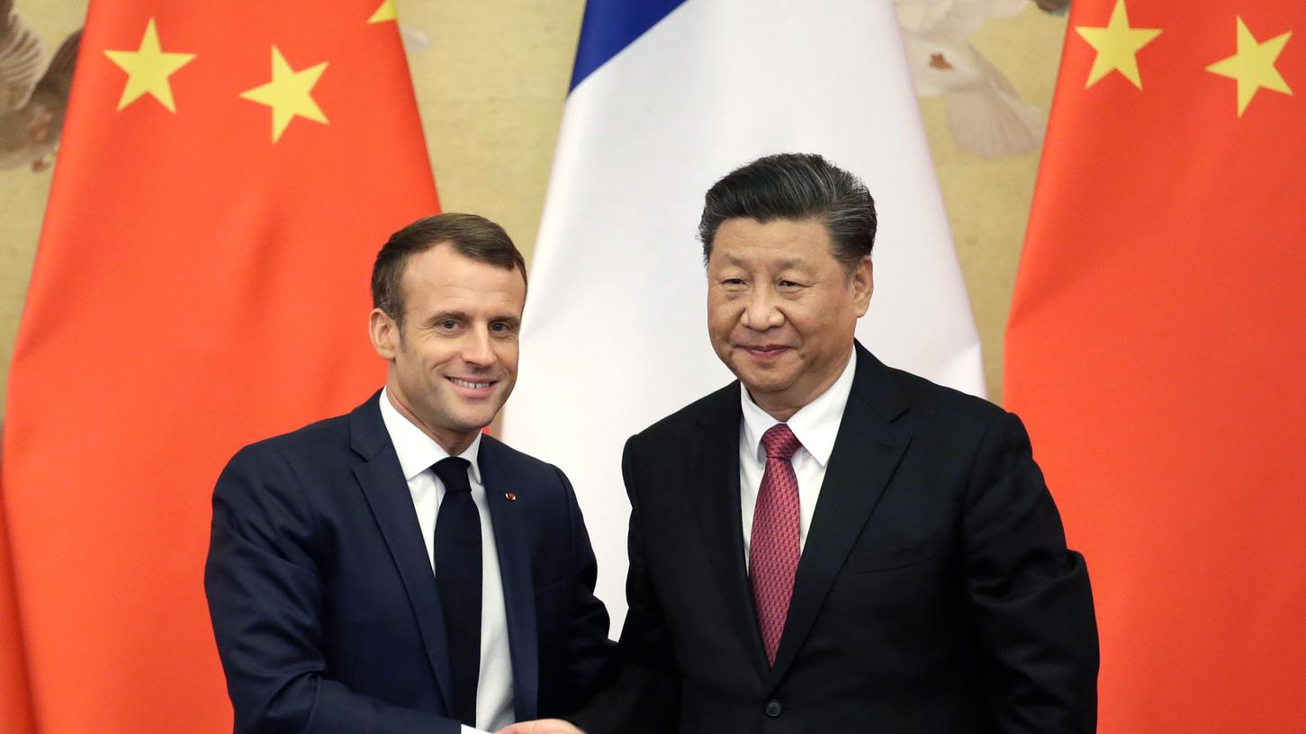Emmanuel Macron (l), Staatspräsident von Frankreich, und Xi Jinping, Staatspräsident von China haben sich zum Klimaabkommen bekannt.