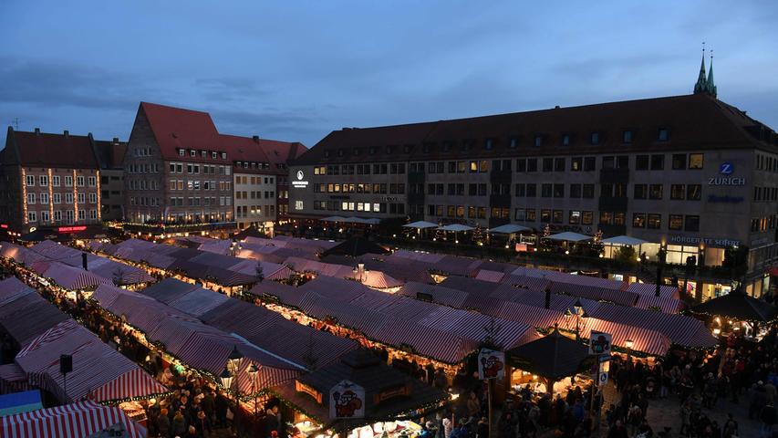 The traditional Christmas Market opens in front of the Frauenkirche (Church of Our Lady) in Nuremberg, southern Germany, on November 29, 2019. - The traditional "Nuernberger Christkindlesmarkt" is open until December 24, 2019. (Photo by Christof STACHE / AFP)