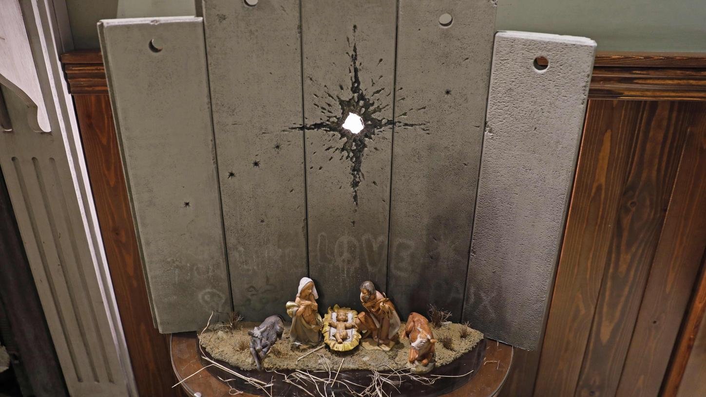 Banksy zeigt Heilige Familie an der Mauer zu Palästina Banksy zeigt Heilige Familie an der Mauer zu Palästina