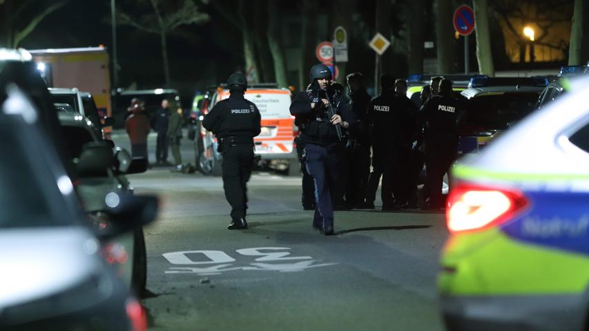 Police gather near the scene of a shooting in Hanau, western Germany, on February 20, 2020. - At least eight people were killed in two shootings late on February 19 near the German city of Frankfurt, with an unknown number of attackers still at large, police said. The shootings targeted shisha bars in Hanau, about 20 kilometres (12 miles) from Frankfurt, according to local media, and police launched a huge manhunt in the town of around 90,000 people. (Photo by Yann Schreiber / AFP)