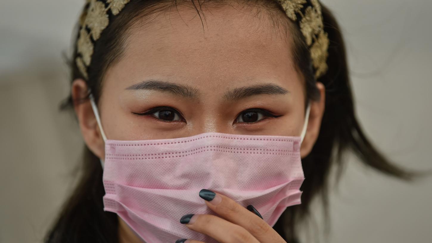 Das tägliche Kleidungsstück in Shanghai: der Mundschutz. Schon vor dem Ausbruch des Corona-Virus trugen viele Stadtbewohner einen Mundschutz wegen der schlechten Luft.