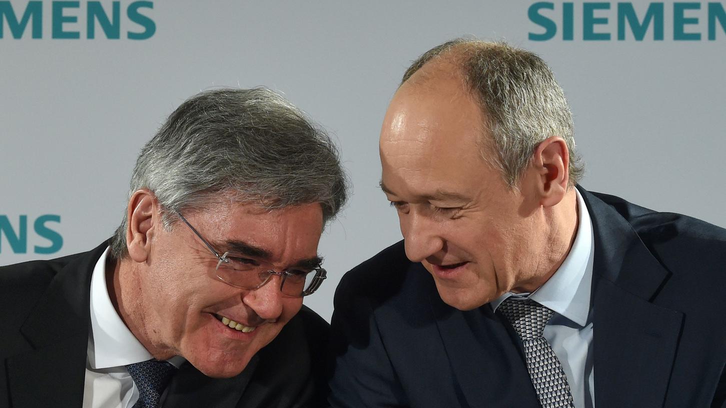 Joe Kaeser (links) geht, Roland Busch wird sein Nachfolger an der Siemens-Spitze: Für den Konzern ist das mehr Chance als Risiko.